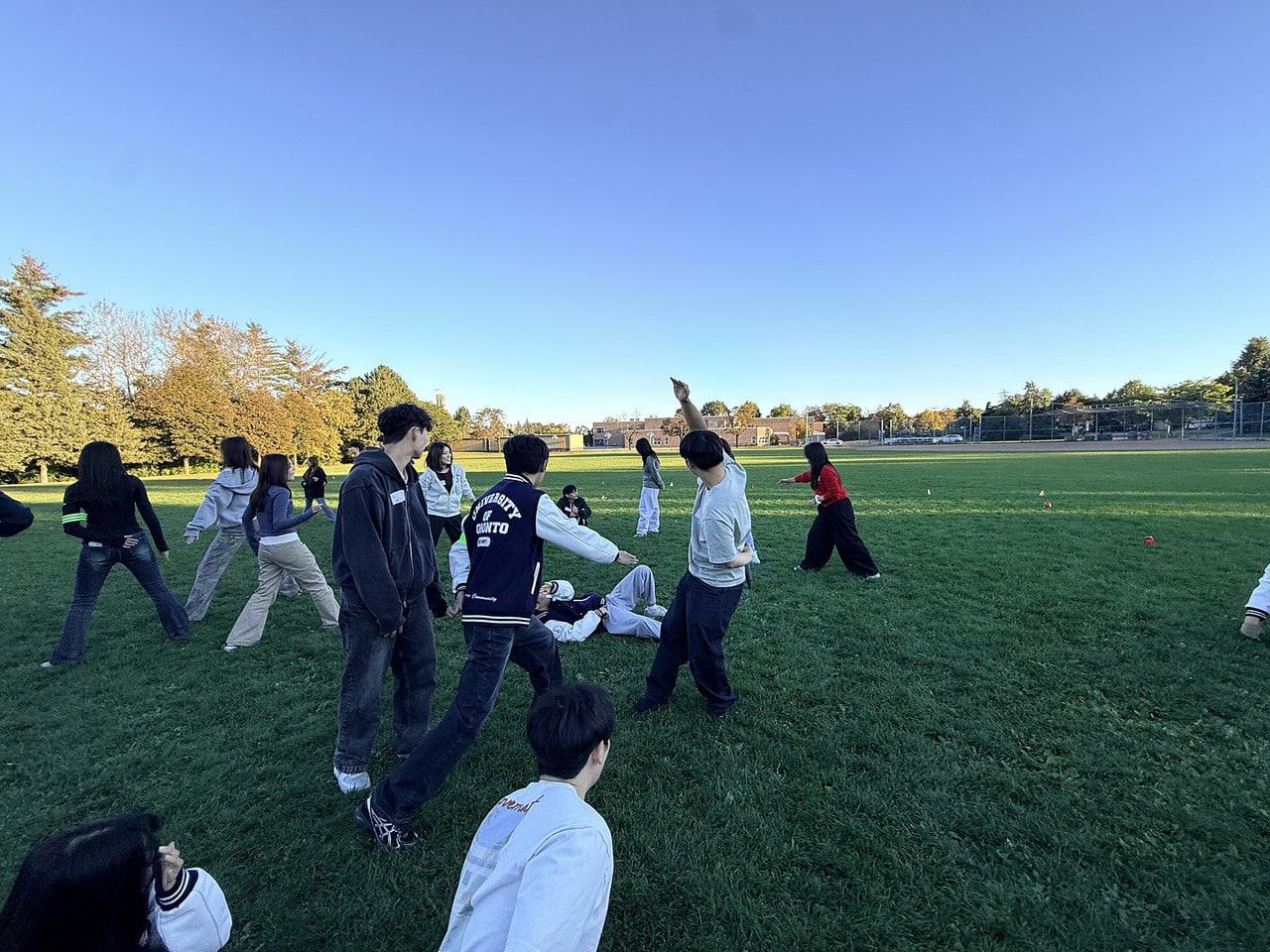 Members running a game in the park