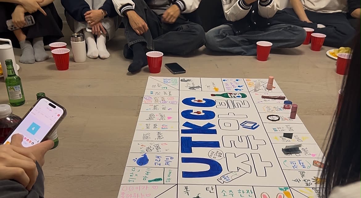 Members playing a UTKCC board game