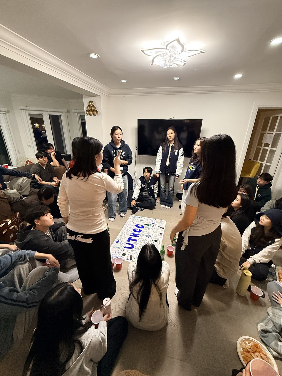 Members hanging out at a house social